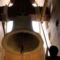 Bell ringer playing  in the tower bell next to the cathedral of Valencia, Spain