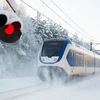 Dutch,Yellow,And,Blue,Train,Riding,In,The,Snow