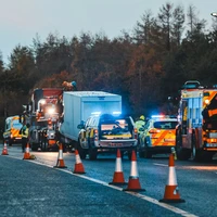 a couple of trucks that are sitting in the street