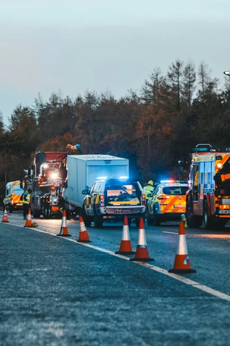 a couple of trucks that are sitting in the street