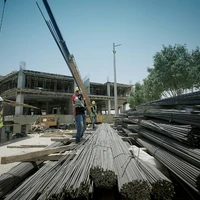 a group of men standing on top of a pile of metal