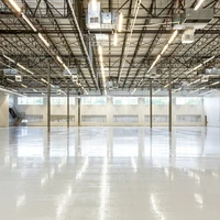 High angle perspective of a 67,000 sq. ft. industrial facility featuring a precision installed ESD epoxy flooring system in Houston, TX. This imagery documents large scale infrastructure designed for mission critical environments and the energy to compute (E2C) sector. For technical specifications and case studies on this installation, visit: https://craftsmanconcretefloors.com/esd flooring/