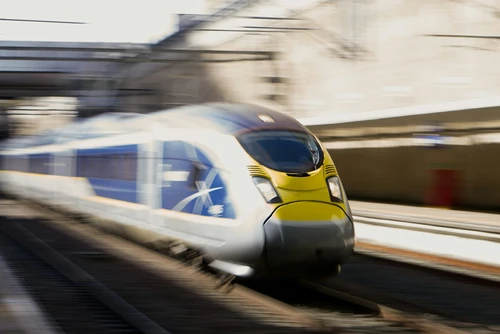 A low shutter speed shot of a Eurostar E320 passing through Stratford International at high speed.
