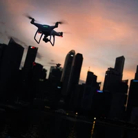 Flying a drone at dusk in the city