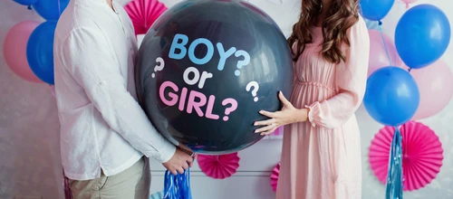 Man,And,Woman,Holding,Black,Balloon,With,"boy,Or,Girl?"